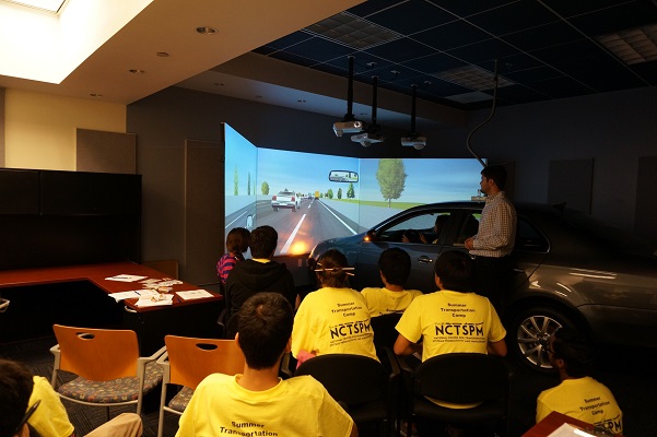 <span style="font-size:10px">&nbsp;Camp students at the FIU Driving Simulation lab&nbsp;</span>